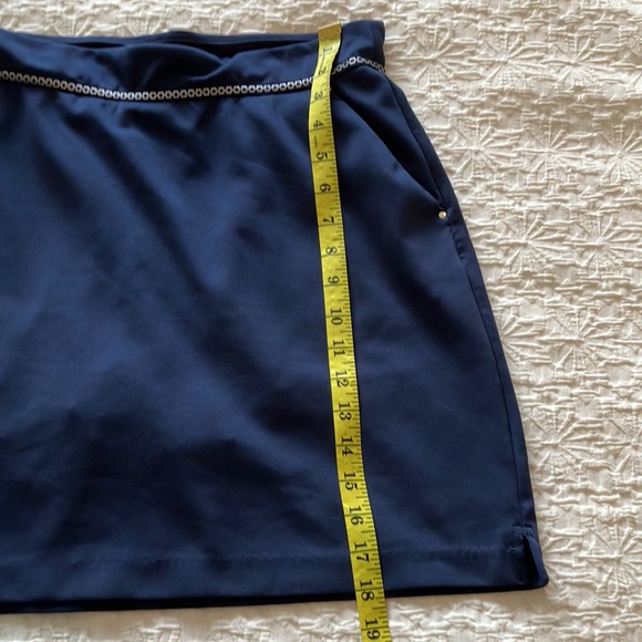 Great Greg Norman navy skort with navy and silver braid around waistband. - Picture 11 of 15